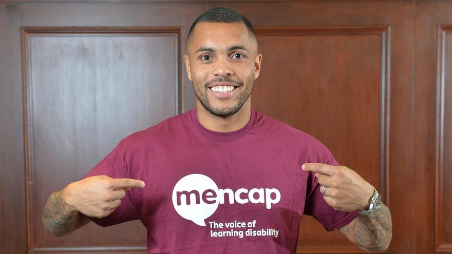 Man wearing a Mencap t-shirt