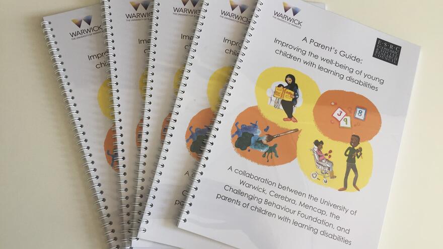 Copies of Parents Guide laid on table
