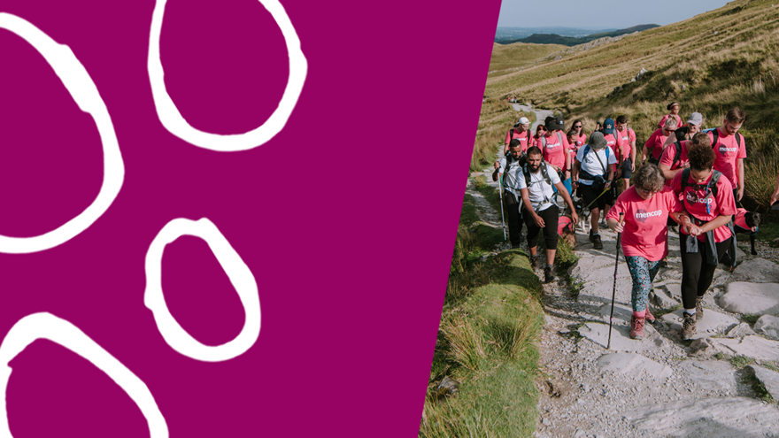 Hikers walking up a mountain path in Mencap T-shirts