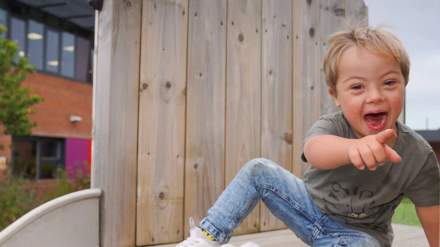 Image of child on a slide