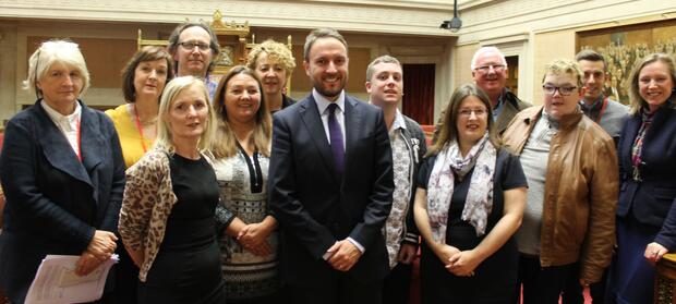 Group of people stood together in Parliamentary building