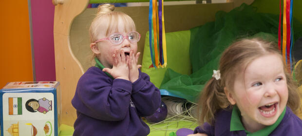 Daisy and Lucy sat together playing at Mencap Centre