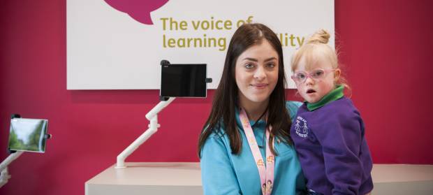 Woman at Mencap Children's Centre in Belfast holding young girl