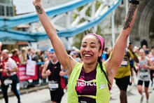 A female runner cheering in the crowds