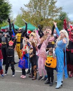 Group of people wearing superhero costumes